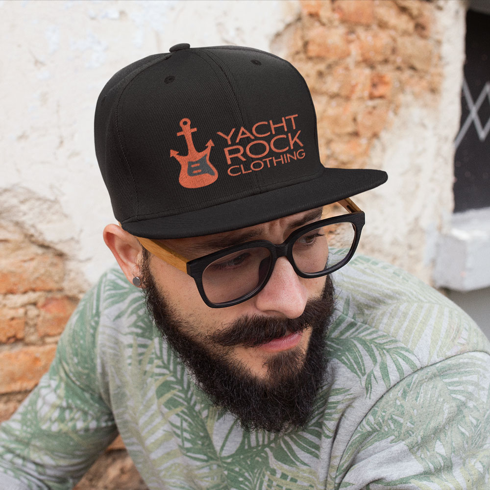 Guy wearing Yacht Rock Clothing logo hat.
